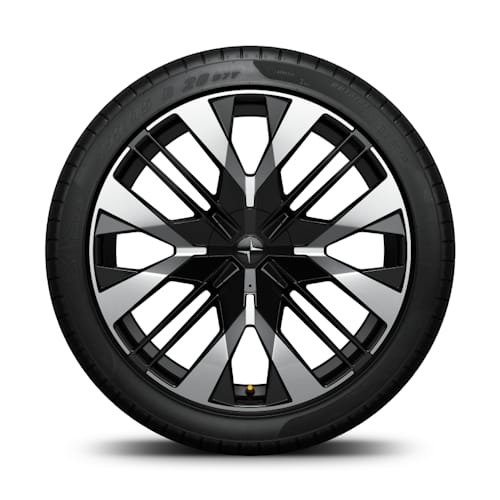 Polestar car wheel with black and silver geometric design and visible tire tread.