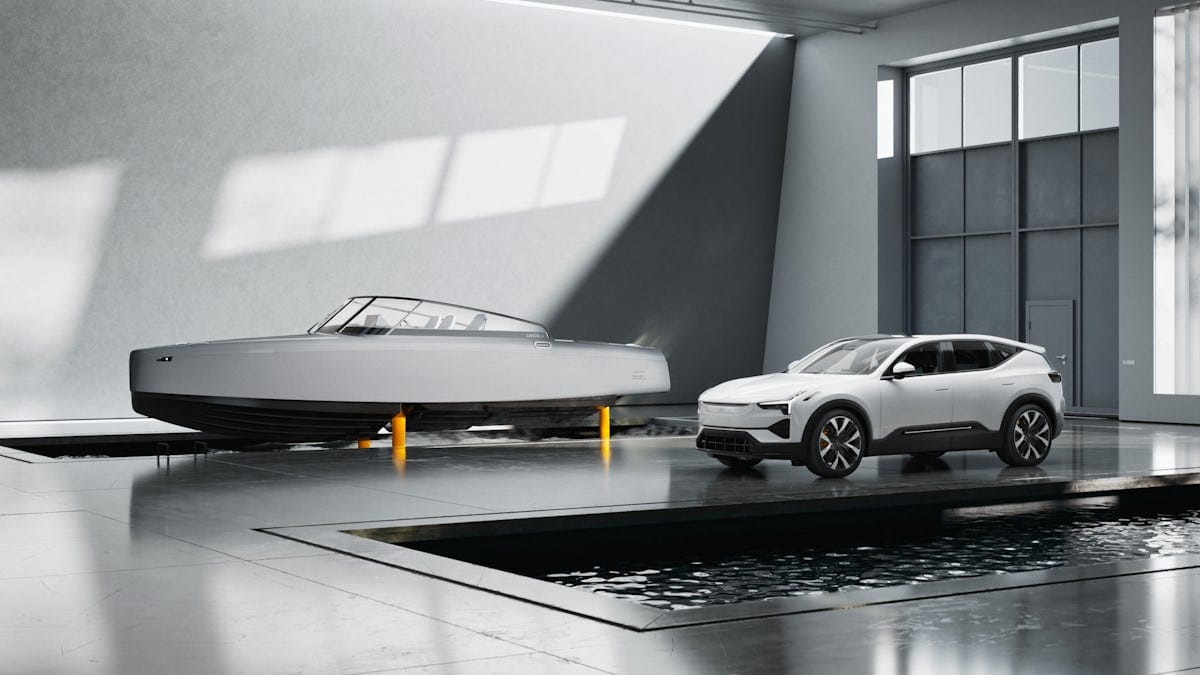 Grey Candela boat on golden foils next to a white polestar 3 car